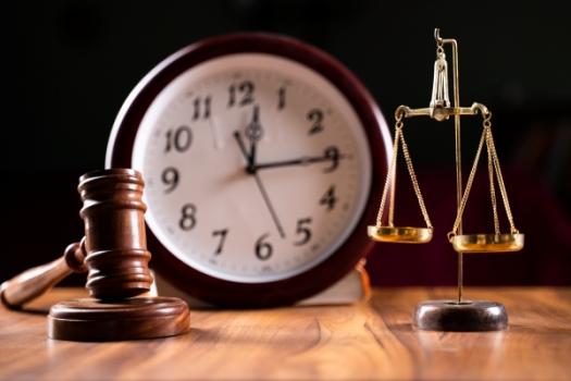 Dallas County District Court Grants Kahana Feld’s Motion to Dismiss for Want of Prosecution Clock Gavel Scale of Justice