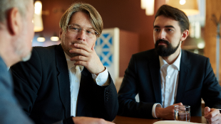 Be Careful in Contracting and Business Three businessmen sharing ideas, looking pensive
