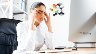 Measures Landlords and Property Managers Can Take in Response to a Reported COVID-19 Infection Businesswoman sitting at desk with headache