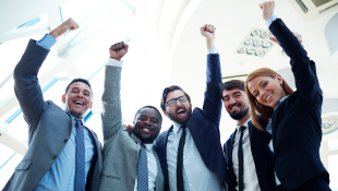Ahlers, Cressman & Sleight PLLC Ranked Top Washington Law Firm By Construction Executive Team of business people raising their arms in triumph