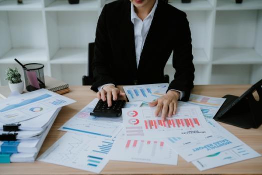 Worker calculating documents budgets