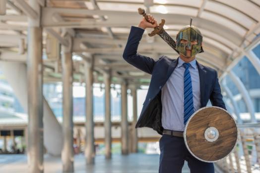 Man in suit with helmet shield sword