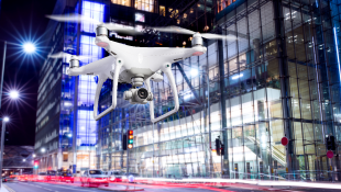 Drone Operation in a Construction Zone Drone flying through city