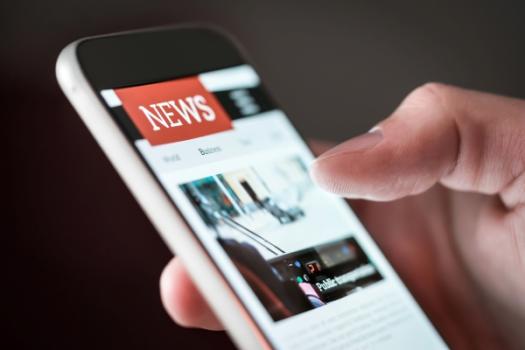 Real Estate & Construction News Roundup (7/23/25) – Builders Look for Startups, AI Transforms Real Estate and Interest Rates Stall Construction Momentum News on cell phone