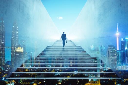 Business person climbing stair of success