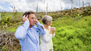 As Laura Wreaks Havoc Along The Gulf, Is Your Insurance Ready to Respond? Senior couple looking at hurricane damage
