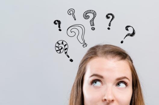 Question marks above woman
