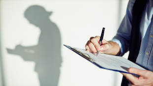 Make Sure to Properly Perfect and Preserve Construction Lien Rights Businessman with clipboard signing document