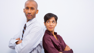 Be a Good Neighbor: Techniques to Mitigate the Risk of Claims from Adjacent Landowners Two business people back to back