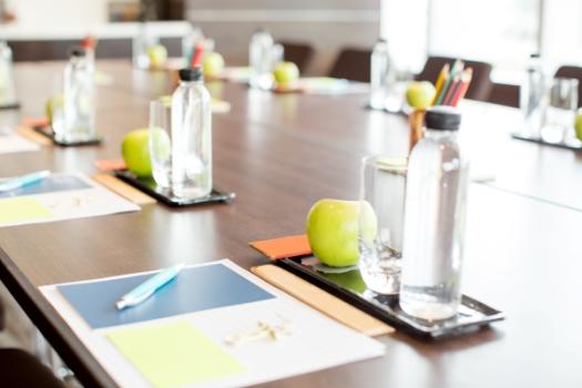 Seminar table with water notebook