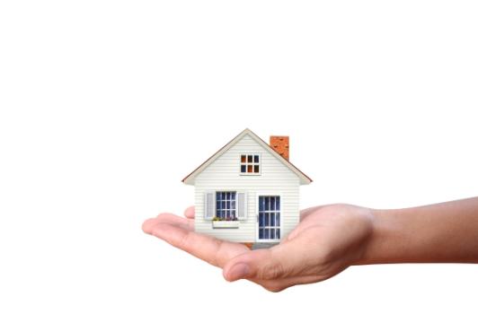 Hand holding house