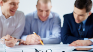 Three businessmembers discussing something