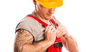 Cold Stress Safety and Protection Construction worker pinning something to uniform