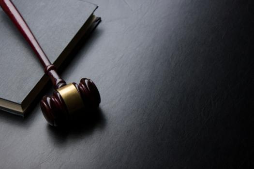 Gavel lying on law book