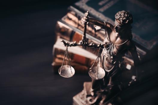 Lady law scale and legal books