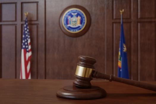New York Team Secures Dismissal of Premises Liability Action Against Client New York emblem in courtroom