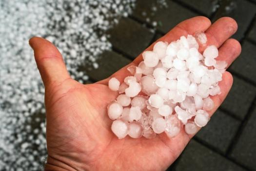 Insureds’ Altering Dates for Hailstorm Damage Justifies Denial of Claim Hail in hand over roof