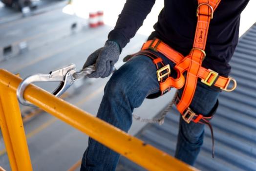 Worker with safety harness