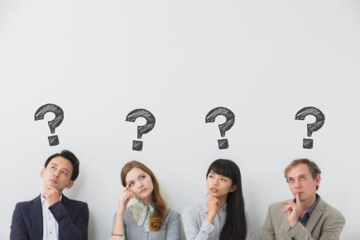 Group of people with question marks above their heads