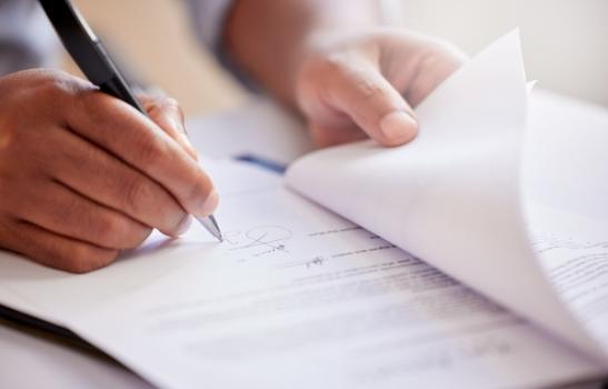 Pay-If-Paid: What You Need to Know Before Signing on the Dotted Line Signing document