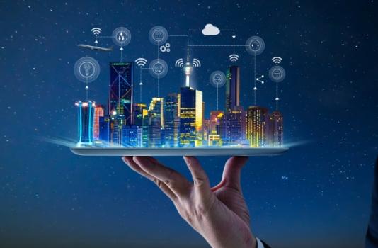 Hand holding up smart city