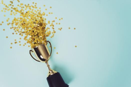 Ahlers Cressman & Sleight leads in recognized Construction Litigation Attorneys Confetti coming out of trophy