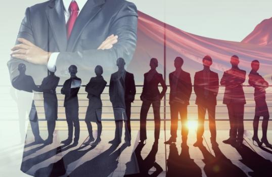 Business people in capes