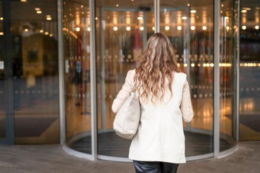 Woman at revolving door