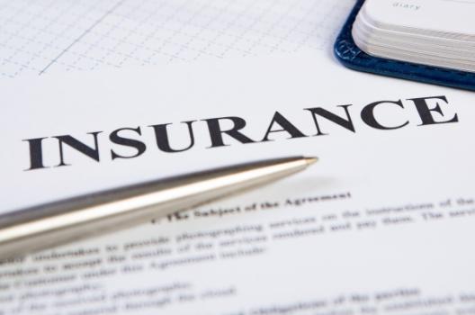 Looking for a Way Out Pen lying on Insurance doc