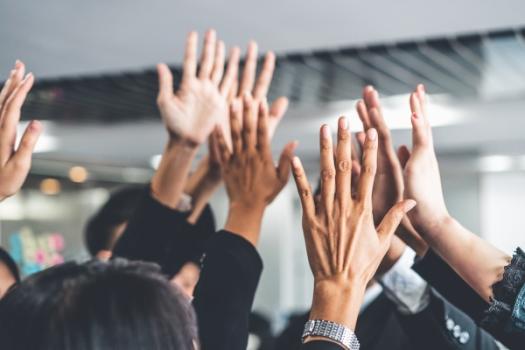 The Salt Lake Tribune Names Snell & Wilmer a Winner of the Top Workplaces 2025 Award Hands up in air in celebration