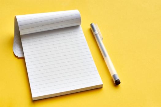Quick Note: Liability Insurer’s Duty to Defend and Duty to Indemnify Pen next to notebook
