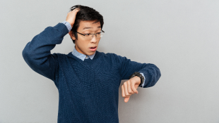 No Damage for Delay? No Problem: Exceptions to the Enforceability of No Damage for Delay Clauses Man looking at watch with late expression