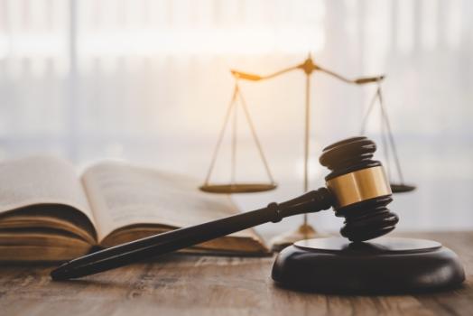 Additional Insureds Obligated to Meet Self-Insured Retention Gavel law book and scale
