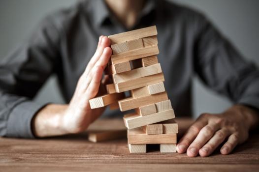 Jenga game person holding it up