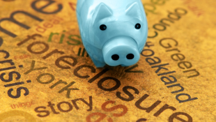 Keeping Detailed Records: The Best Defense to Constructive Eviction Piggy bank sitting on foreclosure and other words