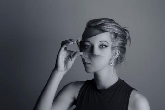 Woman holding mirror distortion