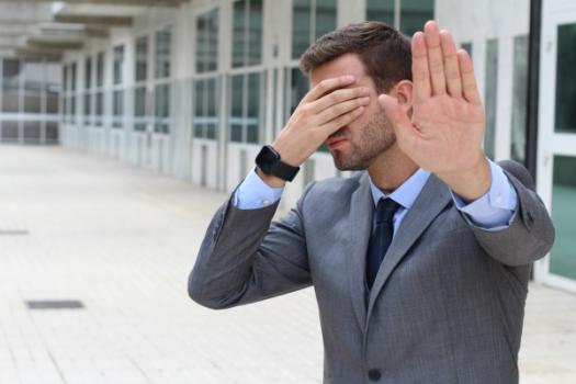 Insured’s Counsel Sanctioned for Filing Pleading with No Legal or Factual Justification Businessman covering face