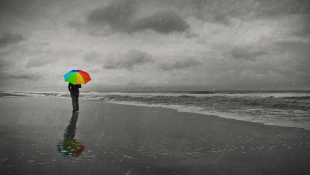 New York Appellate Court Addresses “Trigger of Coverage” for Asbestos Claims and Other Coverage Issues Businesswoman holding umbrella on beach