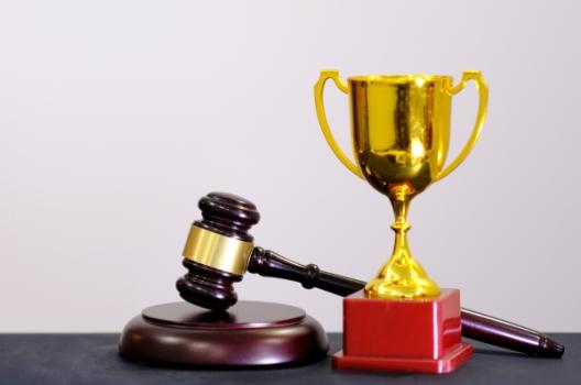BWB&O ranks as a 2025 Best Law Firm by Best Lawyers® Gavel next to trophy