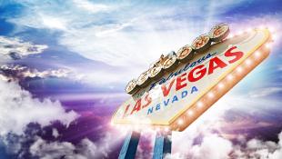 Las Vegas Sign below vivid blue and purple sky