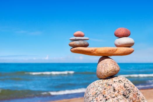 Rocks balancing weighing near beach