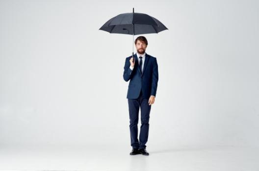Additional Insured May Pursue Coverage and Contractual Indemnity Businessman with umbrella symbolizing coverage